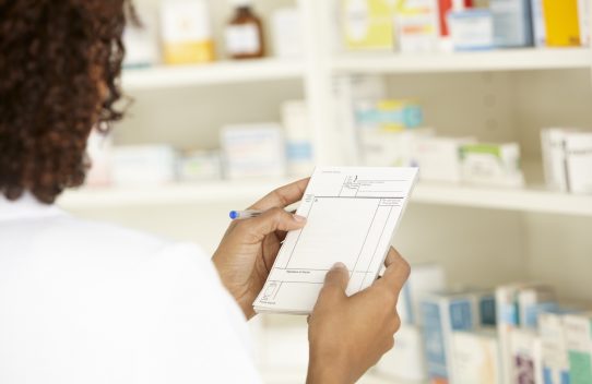 A pharmacist check a prescription